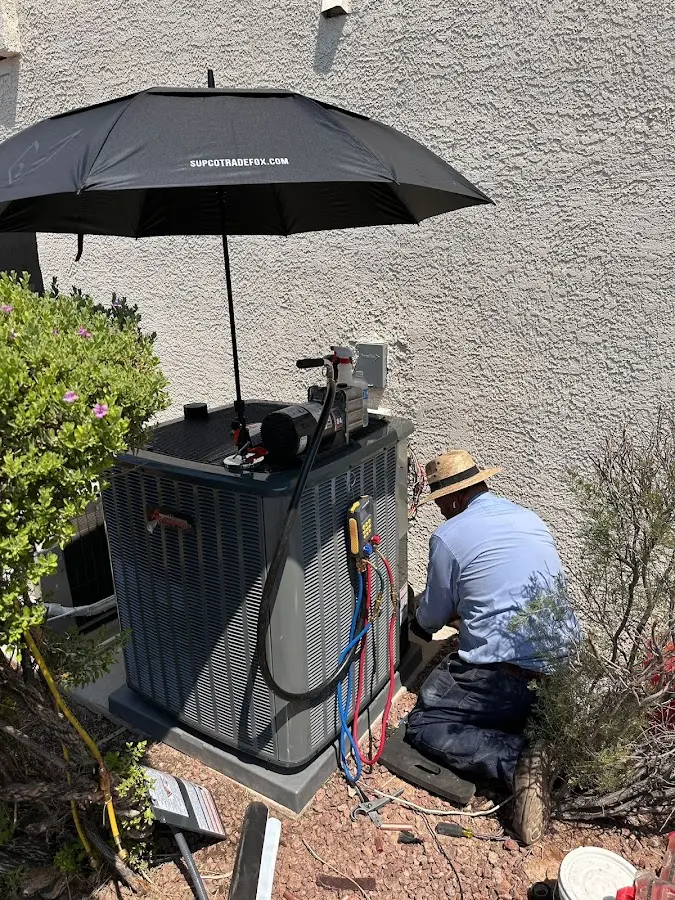 HVAC technician performing outdoor AC maintenance in Citrus Springs