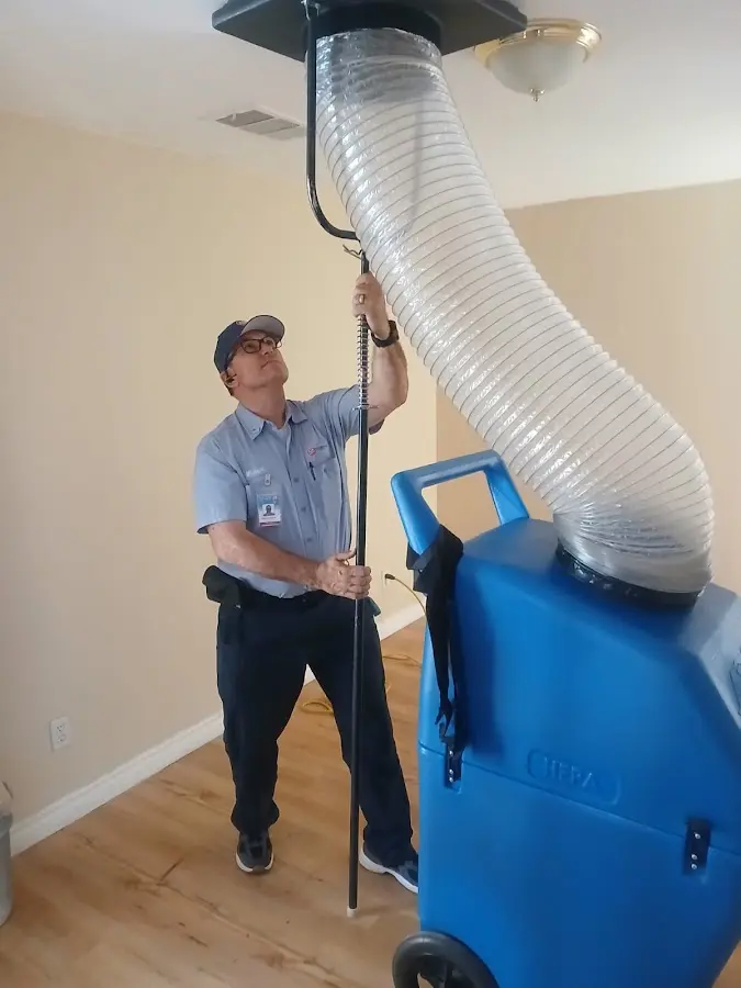 Furnace Tune-Up technician using HEPA equipment in Citrus Springs